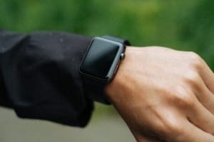 a man looking at his smartwatch