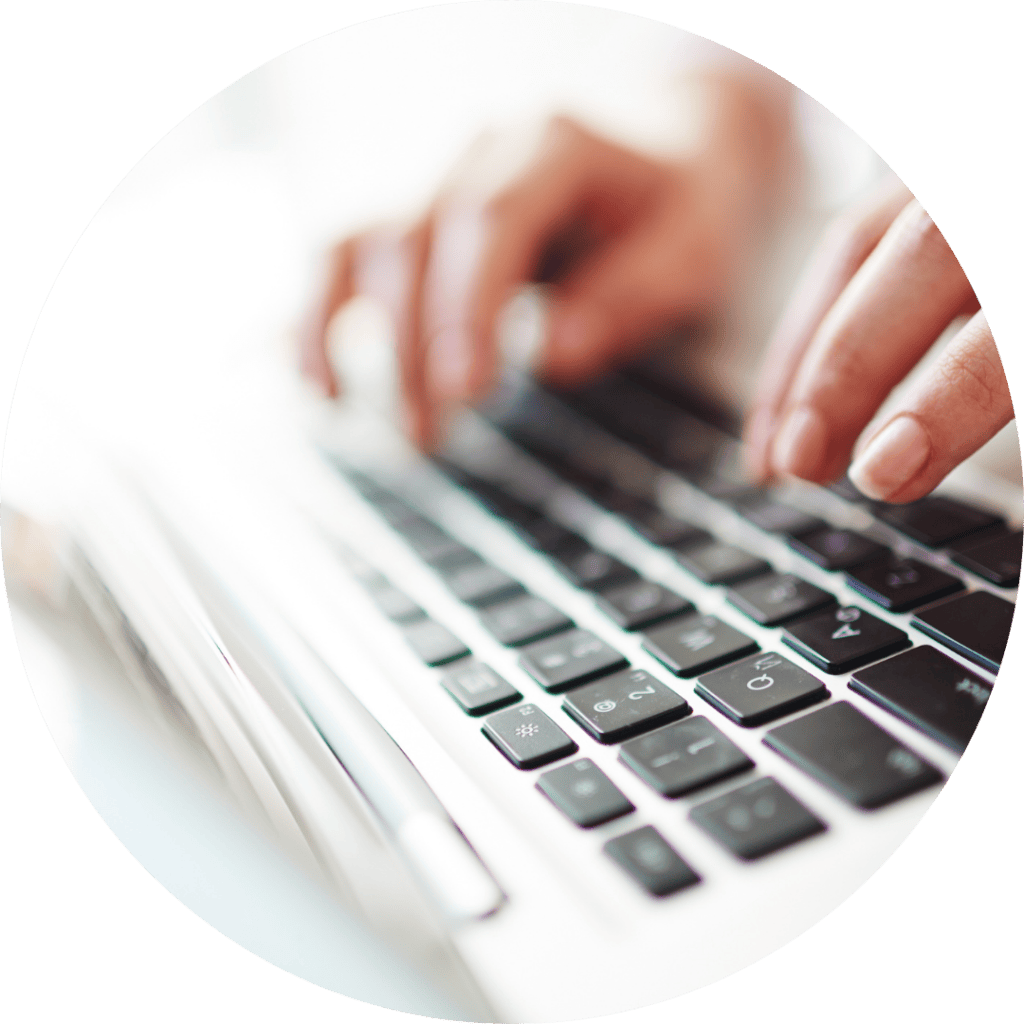 hands typing on keyboard