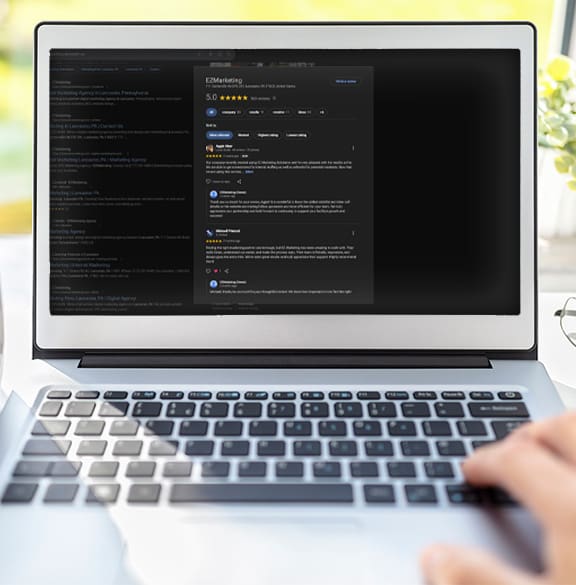 Laptop computer at office desk background with blank screen